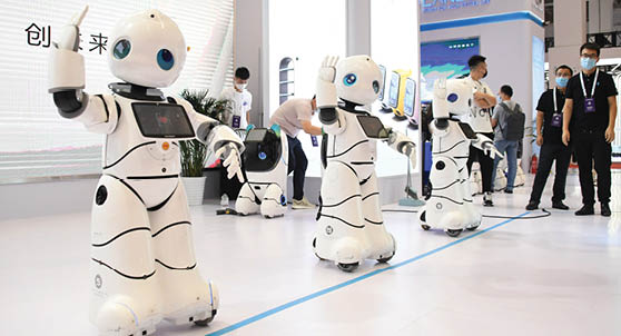 (210913) -- BEIJING, Sept. 13, 2021 (Xinhua) -- Service robots dance during the World Robot Expo in Beijing, capital of China, Sept. 10, 2021. TO GO WITH XINHUA HEADLINES OF SEPT. 13, 2021. (Xinhua/Ren Chao)